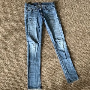 Levis too superlow 524 skinny jeans with flap button back pockets